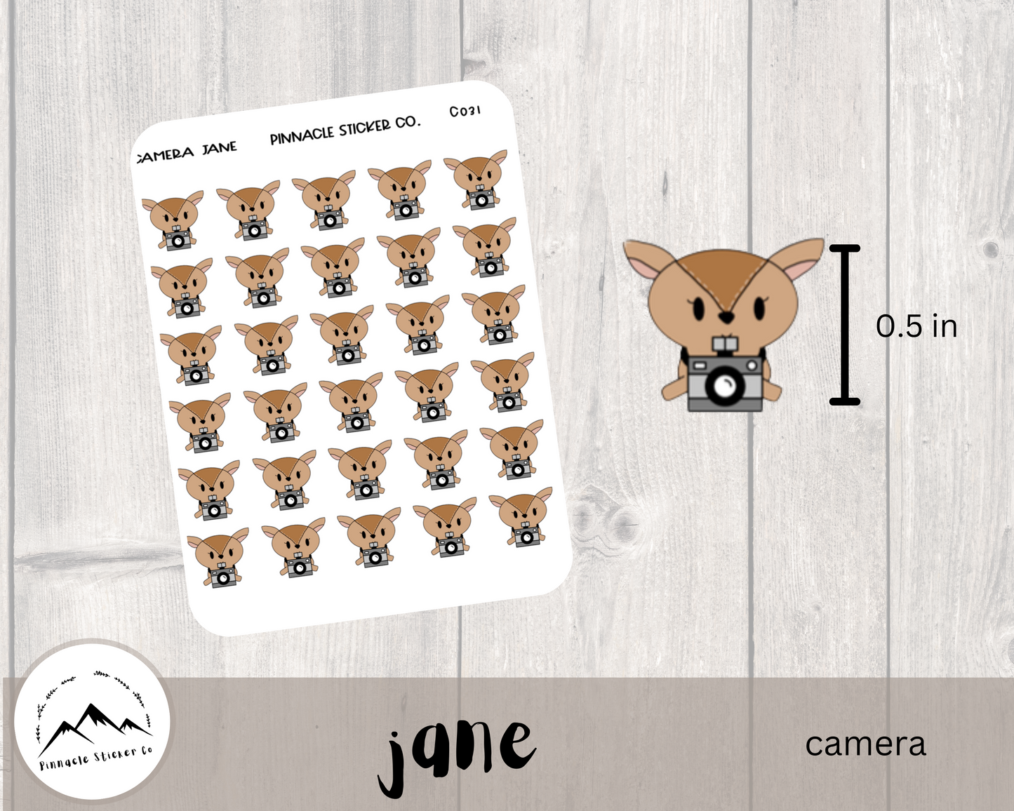 hand drawn deer character sticker measuring 0.5 in high. camera